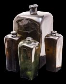 Four mould blown Dutch gin bottles of shouldered square profile with raised everted neck,