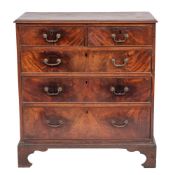 A George III mahogany chest of drawers, circa 1770; the top with ogee moulded edges,
