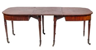 WITHDRAWN A late George III mahogany extending dining table, circa 1800,