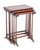 A nest of three mahogany occasional tables in Regency style,
