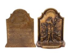 A pair of relief cast brass Trusty Servant bookends,