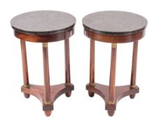 A pair of mahogany, gilt metal and marble mounted gueridons in Empire style,