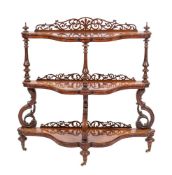 A Victorian walnut and burr walnut three tier whatnot, circa 1870; serpentine fronted,