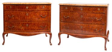 A pair of kingwood parquetry and marble topped serpentine front commodes in late Louis XV