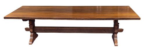 A substantial oak trestle dining table in 17th century taste,