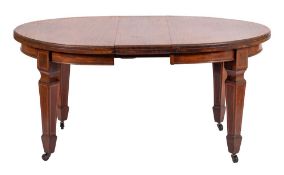 A late Victorian or Edwardian mahogany and line inlaid extending dining table,