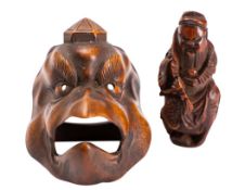 A Japanese boxwood toggle and a Chinese hediao nut carving,