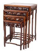 A nest of four Chinese hardwood occasional tables, 20th century; of rectangular form,