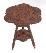 A south east Asian, probably Anglo Burmese carved and stained hardwood occasional table,