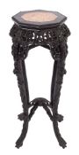 A Chinese carved hardwood and marble inset stand,