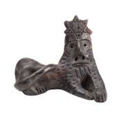 A pottery model depicting The Lion of Judah in recumbent pose, crowned with the Star of David,
