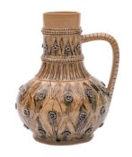 A Doulton Lambeth stoneware ewer incised with bands of stiff leaves and applied flower heads under