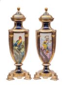A pair of Continental porcelain triform vases and covers in the Sèvres manner each decorated with
