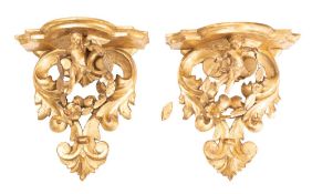 A pair of Florentine giltwood wall brackets,