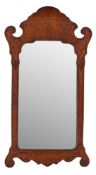 A walnut and seaweed marquetry framed wall mirror in the manner of late 17th century examples,
