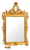 A pair of carved and giltwood framed wall mirrors in Louis XIV style,
