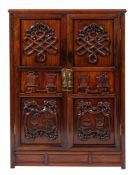 A Chinese carved and stained hardwood side cupboard,