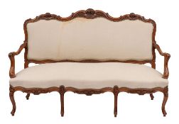 A suite of carved walnut and cream fabric upholstered salon furniture in Louis XV style,