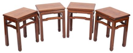 A set of four Chinese hardwood, probably huanghuali occasional or urn tables,