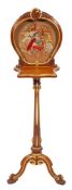A George IV or William IV parcel gilt satinwood and embroidery worked screen stand,