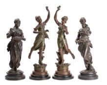 A pair of late 19th century spelter figures of young women holding sprays of flowers,