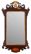 A mahogany and parcel gilt framed wall mirror in George I style,
