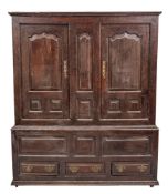 A George II oak linen cupboard,