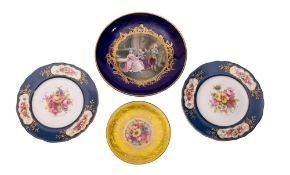 A pair of Royal Worcester porcelain plates, a similar small dish and a Sevres-style dish,