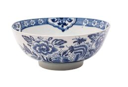 An Isleworth blue and white slop bowl the exterior painted with peony sprays,