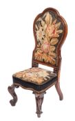 A William IV or Victorian rosewood and petit point embroidered nursing chair,