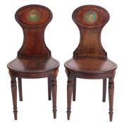 A pair of Regency mahogany hall chairs,