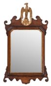 A walnut and parcel gilt framed wall mirror in George I taste,