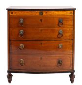 A Regency mahogany and satinwood banded bowfront commode chest; early 19th century;