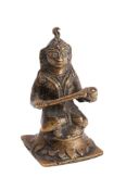 An Indian cast bronze figure of Shiva seated cross-legged on a lotus flower,