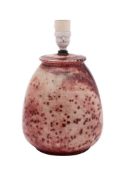 A Ruskin high-fired lamp base covered in a mottled flambé and green speckled glaze,