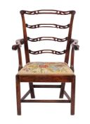 A George III mahogany elbow chair.