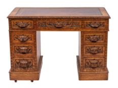 A Victorian carved oak pedestal desk,