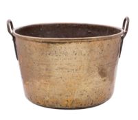 A 19th century large brass and steel log bin of cylindrical outline with steel loop carrying