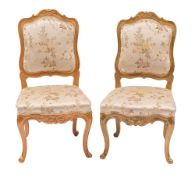 A pair of carved and painted wood salon side chairs in Louis XV style,