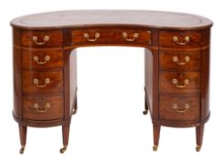 A mahogany, crossbanded and line inlaid kidney shaped desk in George III style,