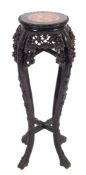 A Chinese carved hardwood and marble inset stand,