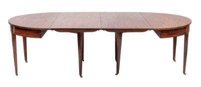 A mahogany extending dining table in George III style,