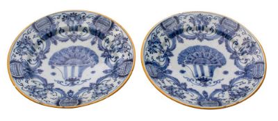 A pair of Dutch blue and white delftware dishes by 'De Griekse A' factory: of conventional design