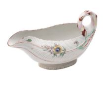 A First Period Worcester polychrome cos lettuce-leaf sauceboat with stalk handle and moulded with