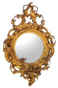 A Regency giltwood and composition framed convex girandole wall mirror,