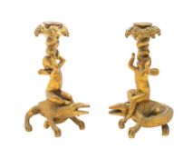 A pair of gilt metal figural candle holders,