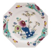 A Bow octagonal plate painted in 'Chinese' famille rose enamels with pierced rockwork,