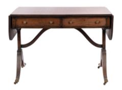 A mahogany sofa table in Regency style,