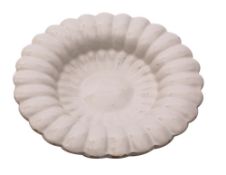 A Dutch white delftware lobed charger with central boss and two rows of gadrooning, circa 1700,