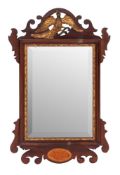An Edwardian mahogany and parcel gilt framed wall mirror in George I taste; early 20th century;